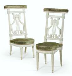 A MATCHED PAIR OF LOUIS XVI WHITE-PAINTED VOYEUSES