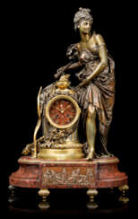 A FRENCH ORMOLU AND PATINATED-BRONZE MOUNTED FIGURAL MANTEL CLOCK