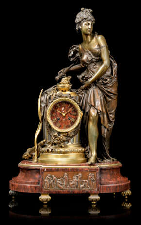 A FRENCH ORMOLU AND PATINATED-BRONZE MOUNTED FIGURAL MANTEL CLOCK - фото 1