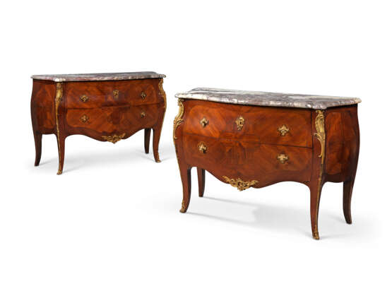 A PAIR OF FRENCH ORMOLU-MOUNTED MAHOGANY AND BOIS SATINE MARQUETRY CHEST-OF-DRAWERS - photo 1