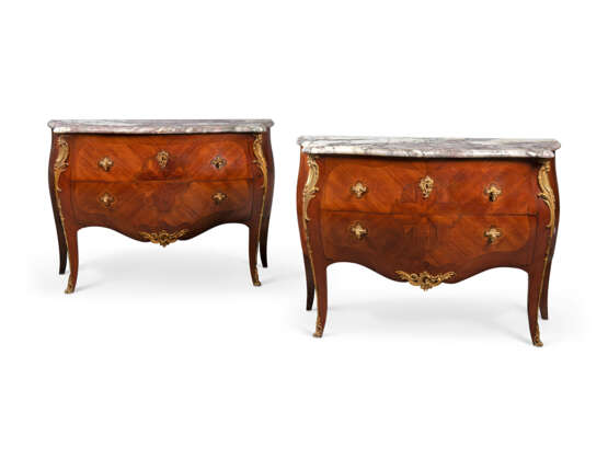A PAIR OF FRENCH ORMOLU-MOUNTED MAHOGANY AND BOIS SATINE MARQUETRY CHEST-OF-DRAWERS - photo 2