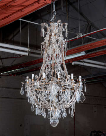 A GILT-METAL CUT, MOULDED AND BEADED-GLASS TWELVE-LIGHT CHANDLIER - photo 1