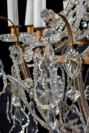 A GILT-METAL CUT, MOULDED AND BEADED-GLASS TWELVE-LIGHT CHANDLIER - photo 7