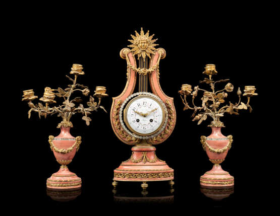 A FRENCH ORMOLU-MOUNTED AND 'JEWELED' PINK MARBLE THREE-PIECE CLOCK GARNITURE - photo 1