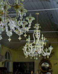 A PAIR OF ITALIAN FROSTED AND PALE-GREEN GLASS NINE-LIGHT CHANDELIERS