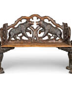 Néo-Rococo. A SWISS 'BLACK FOREST' CARVED AND STAINED WALNUT BENCH