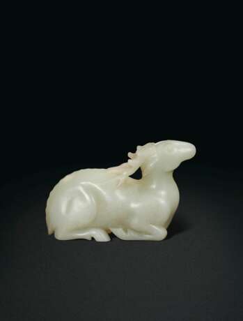 A LARGE WHITE JADE FIGURE OF A RECUMBENT STAG - photo 1