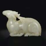 A LARGE WHITE JADE FIGURE OF A RECUMBENT STAG - photo 4