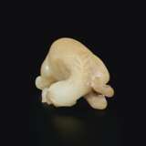 A WHITE AND PALE BROWN JADE FIGURE OF A ROLLING HORSE - photo 3