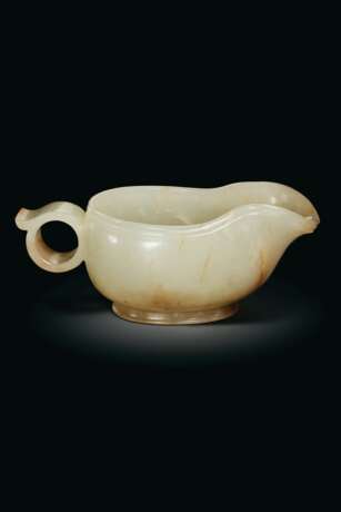 A FINELY CARVED WHITE AND RUSSET JADE POURING VESSEL, YI - photo 1