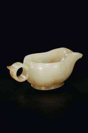 A FINELY CARVED WHITE AND RUSSET JADE POURING VESSEL, YI - photo 2