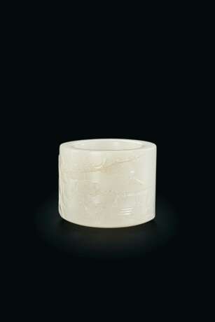 A CARVED WHITE JADE THUMB RING - photo 1