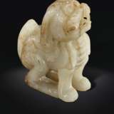 A SMALL PALE GREENISH-GREY JADE FIGURE OF A MYTHICAL BEAST - photo 3