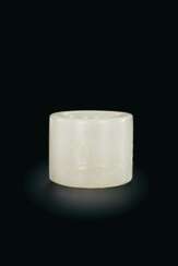 A LARGE WHITE JADE THUMB RING