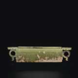 AN UNUSUAL ARCHAISTIC OLIVE-GREEN JADE RECTANGULAR VESSEL WITH HANDLES - фото 1