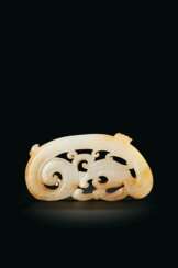 AN ARCHAISTIC WHITE AND PALE RUSSET JADE &#39;DRAGON&#39; PLAQUE