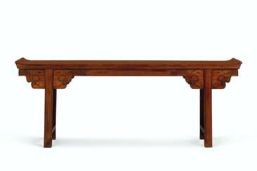 A RARE MASSIVE DEMOUNTABLE HUANGHUALI TRESTLE-LEG TABLE