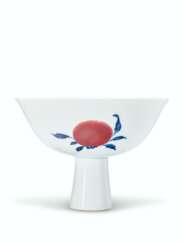 A RARE BLUE AND WHITE AND COPPER-RED &#39;SANDUO&#39; STEM BOWL