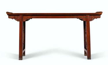 A RARE HUANGHUALI TRESTLE-LEG TABLE