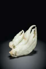 A LARGE WELL-CARVED WHITE JADE ‘BUDDHA’S HAND’ CITRON