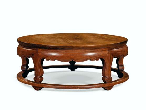 AN UNUSUAL HUANGHUALI ROUND LOW TABLE - photo 1