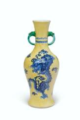 A YELLOW-GROUND BLUE AND WHITE ‘DRAGON’ VASE