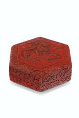 A CARVED RED LACQUER HEXAGONAL BOX AND COVER