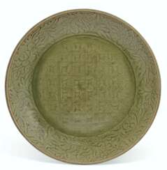 A LARGE CARVED LONGQUAN CELADON DISH