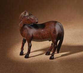 A RARE SMALL CARVED ZITAN FIGURE OF A HORSE