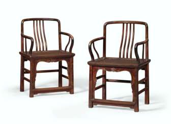 A PAIR OF LOW-BACK WALNUT AMRCHAIRS