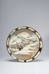 AN EARTHENWARE DISH WITH LANDSCAPE
