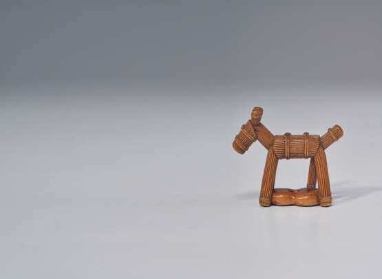 A CARVED WOOD SCULPTURE OF A STRAW HORSE - photo 1