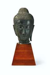 A BRONZE HEAD OF BUDDHA