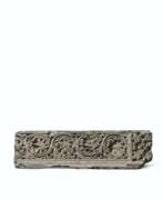Bas-relief. A GRAY SCHIST RELIEF WITH FOLIATE SCROLL