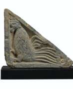 Bas-relief. A GRAY SCHIST STAIR-RISER RELIEF OF A MYTHICAL BEAST