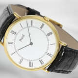 Armbanduhr: sehr flache, goldene und absolut neuwertige Piaget Herren/Damen-Armbanduhr, Ref: 8035N, 18K Gold am Lederband - фото 1