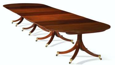 A GEORGE III MAHOGANY FOUR-PEDESTAL DINING TABLE