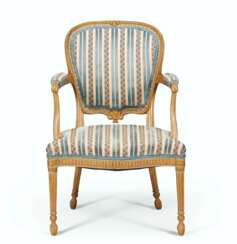 A GEORGE III CREAM-PAINTED AND PARCEL-GILT ARMCHAIR