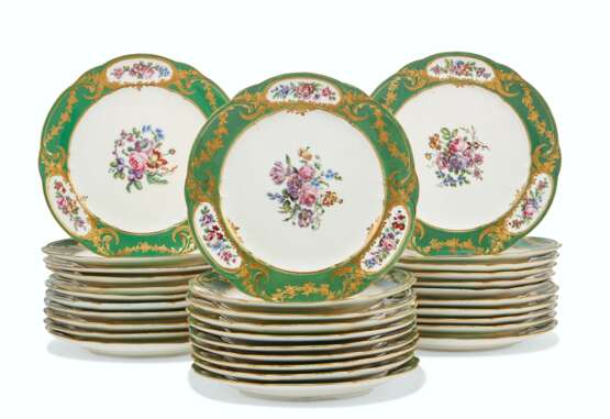 Sèvres Porcelain Factory. AN ASSEMBLED SET OF THIRTY-TWO SEVRES (LATER-DECORATED) PORCELAIN GREEN-GROUND PLATES - фото 1