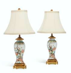 A PAIR OF CHINESE EXPORT ORMOLU-MOUNTED FAMILLE VERTE BALUSTER VASES, MOUNTED AS LAMPS