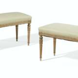 A PAIR OF FRENCH GREEN AND CREAM-PAINTED AND PARCEL-GILT BANQUETTES - фото 1