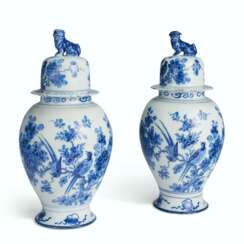 A PAIR OF DUTCH DELFT BALUSTER JARS AND COVERS