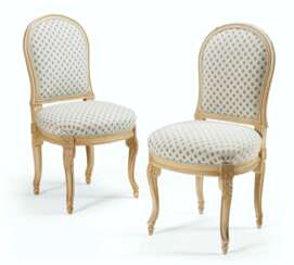 A PAIR OF FRENCH WHITE-PAINTED CHAISES