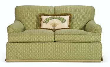 AN UPHOLSTERED TWO SEAT SOFA