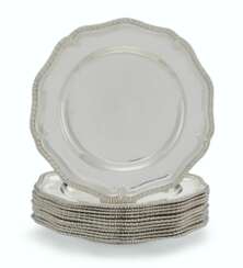 A SET OF TEN GEORGE II SILVER DINNER PLATES AND TWO MATCHING SOUP PLATES
