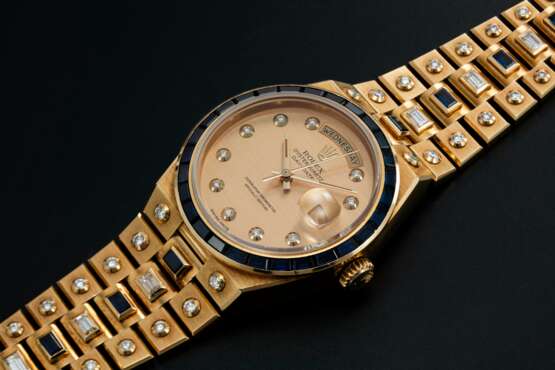 Rolex. ROLEX, A YELLOW GOLD DAY-DATE OYSTERQUARTZ SET WITH DIAMONDS AND SAPPHIRES, REF: 19168 - photo 1
