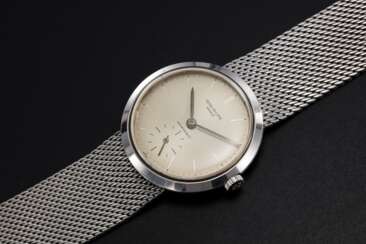 PATEK PHILIPPE, REF. 3419, A STEEL “CONVERTIBLE” WRISTWATCH RETAILED BY HAUSMANN & CO