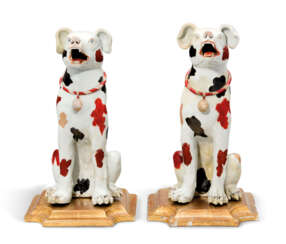 A PAIR OF PORCELAIN MODELS OF HOUNDS