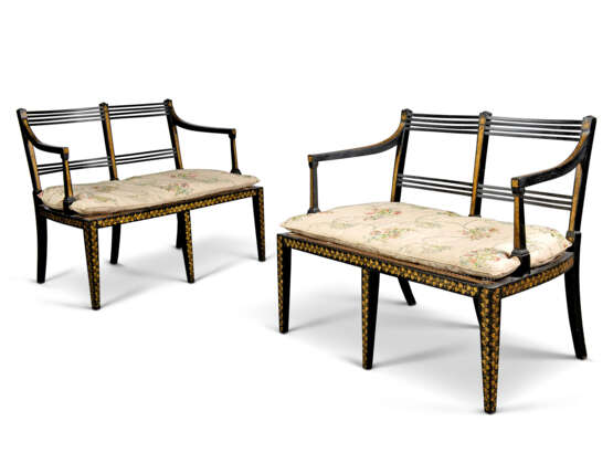 A PAIR OF REGENCY EBONISED AND PARCEL-GILT DOUBLE CHAIRBACK SETTEES - фото 1