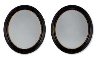 A PAIR OF VICTORIAN EBONISED AND PARCEL-GILT MIRRORS